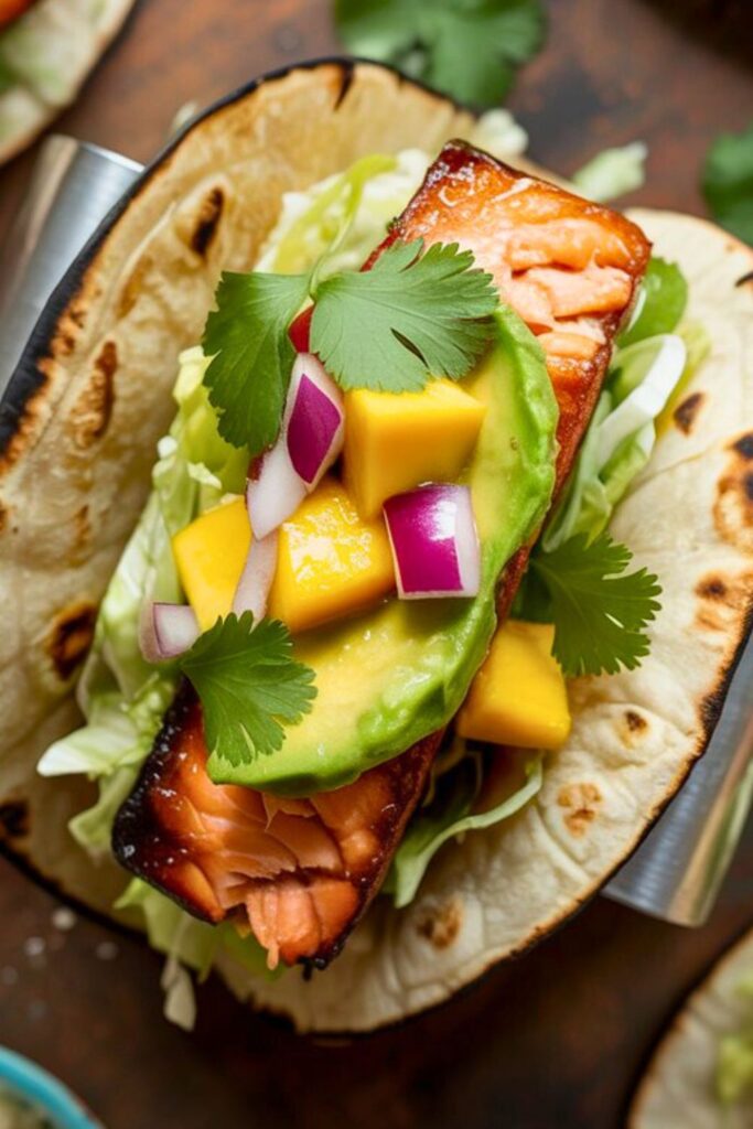 Crispy BBQ Salmon Tacos With Avocado Mango Salsa and Jalapeño